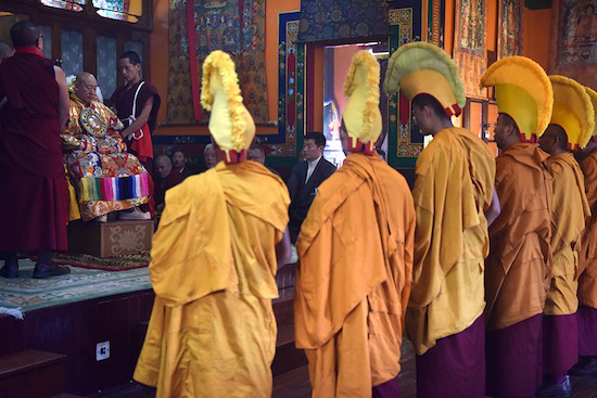 The Tibetan Prime Minister Lobsang Sangay is seated in the background, patiently waiting for an audience with Nechung